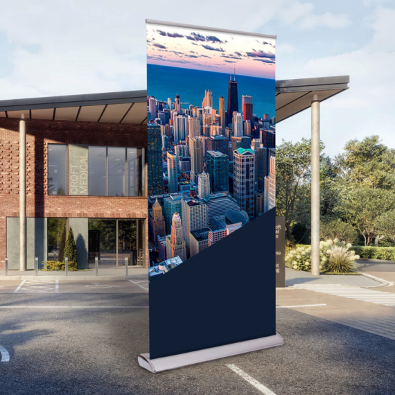 roll-up banner with full colour print standing in front of the building
